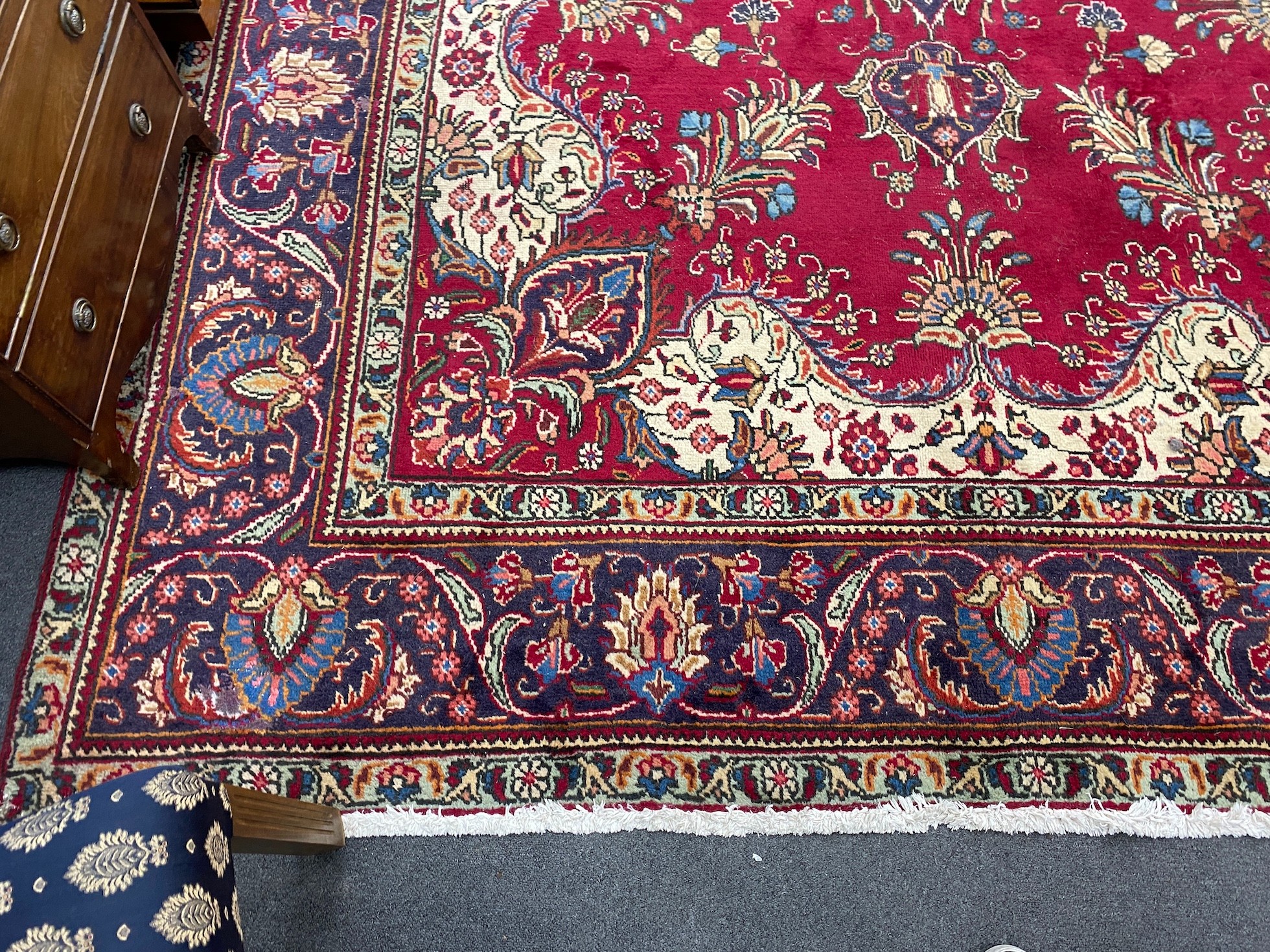 A North West Persian red ground carpet 290cm x 246cm.